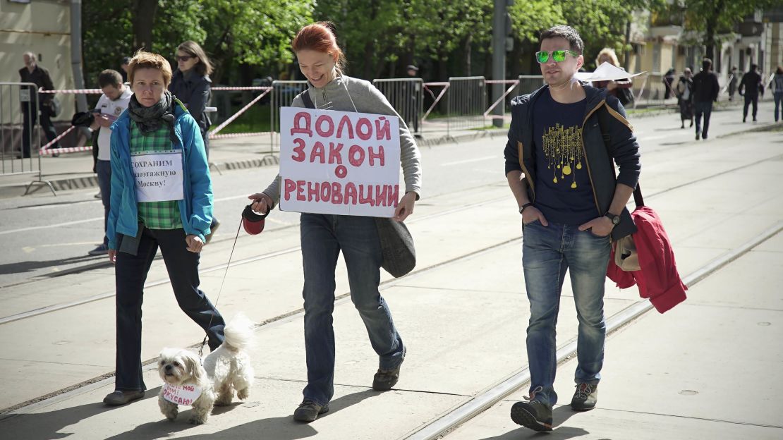 A dog joins Sunday's demonstration.