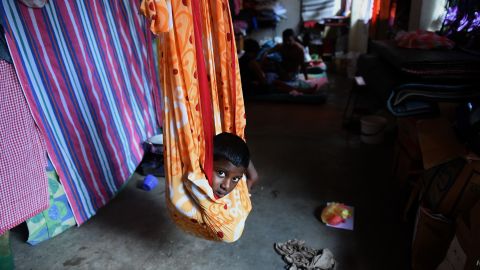 A young Sri Lankan flood victim rests at a relief camp after being evacuated following flooding in the suburb of Kaduwela in the capital Colombo.