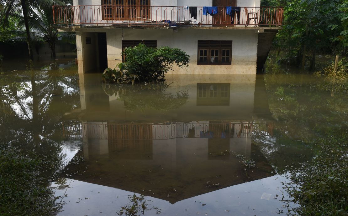 A Sri Lankan home is surrounded by floodwaters in the suburb of Kaduwela in the capital, Colombo.