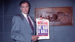 Frank Deford, editor and publisher of The National Sports Daily, holds a proof of the final front page of the newspaper after a news conference at the paper's offices in New York City on Wednesday, June 12, 1991.  He announced that the publication would fold with Thursday's issue. 