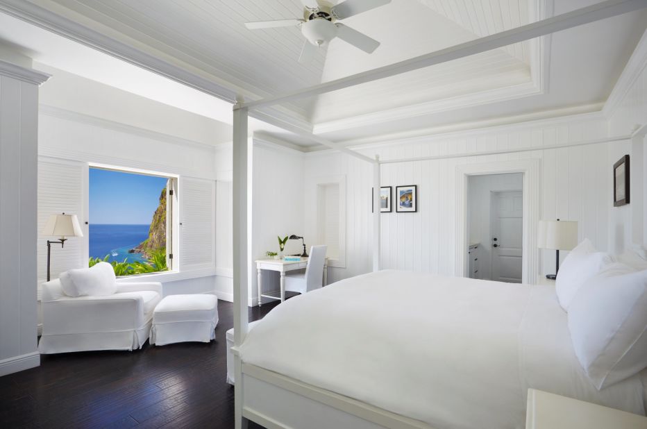 <strong>Sugar Beach, St. Lucia: </strong>Crisp interiors invite the outside in with views of the Pitons and Sugar Beach. Lush gardens add to the spectacular terrain.
