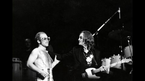 John appears on stage with John Lennon at New York's Madison Square Garden in 1974.