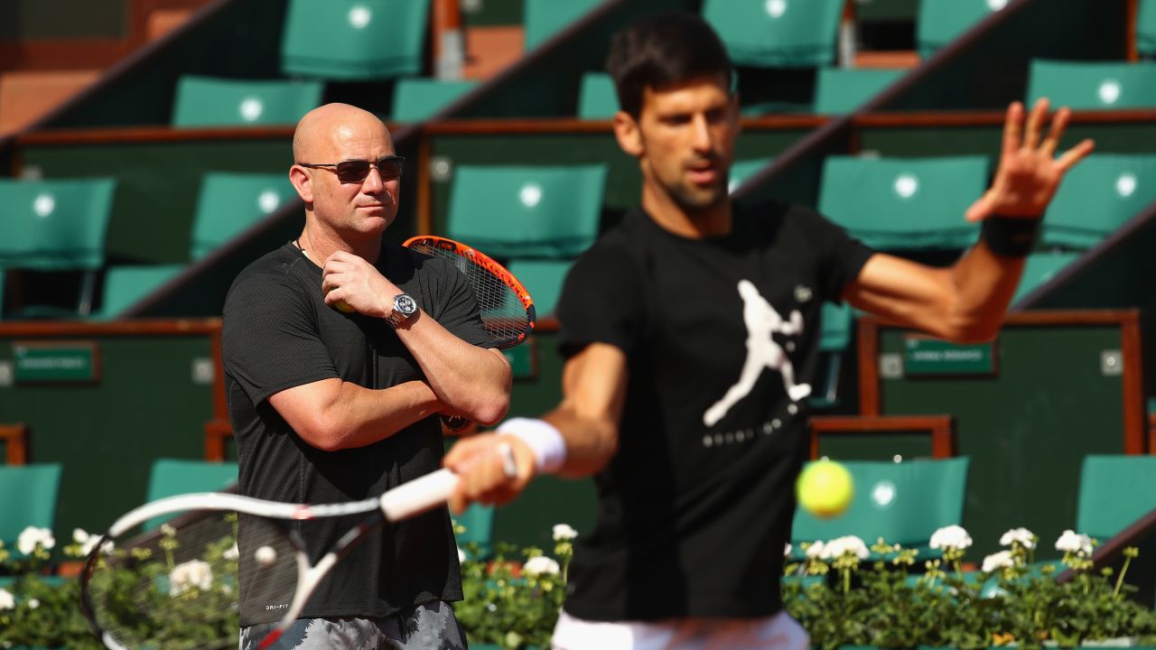 PARIS, FRANCE - MAY 29:  Coach Andre Agassi watches on during a Novak Djokovic training session prior to his match against Marcel Granollers of Spain on day two of the 2017 French Open at Roland Garros on May 28, 2017 in Paris, France.  (Photo by Clive Brunskill/Getty Images)