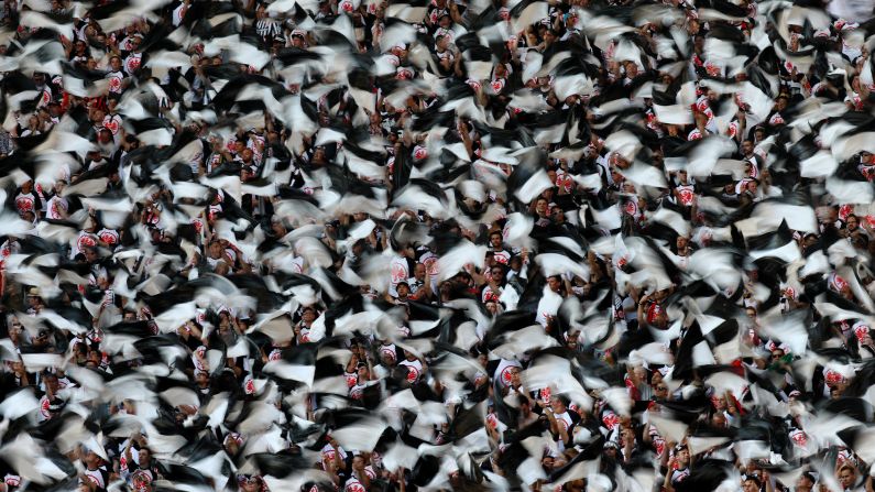 Fans of the soccer club Eintracht Frankfurt participate in a pre-match tifo display before the German Cup final in Berlin on Saturday, May 27.