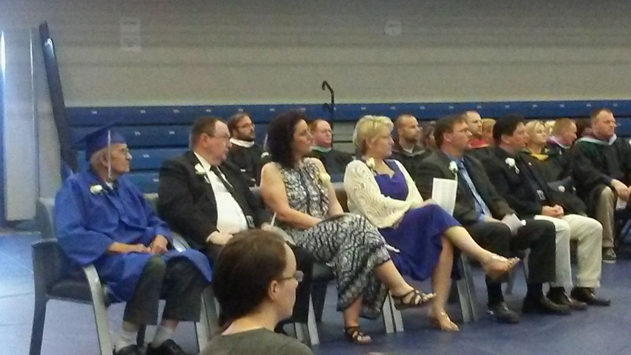 Milton Mockerman, left, at the graduation ceremony at Kalkaska High School.