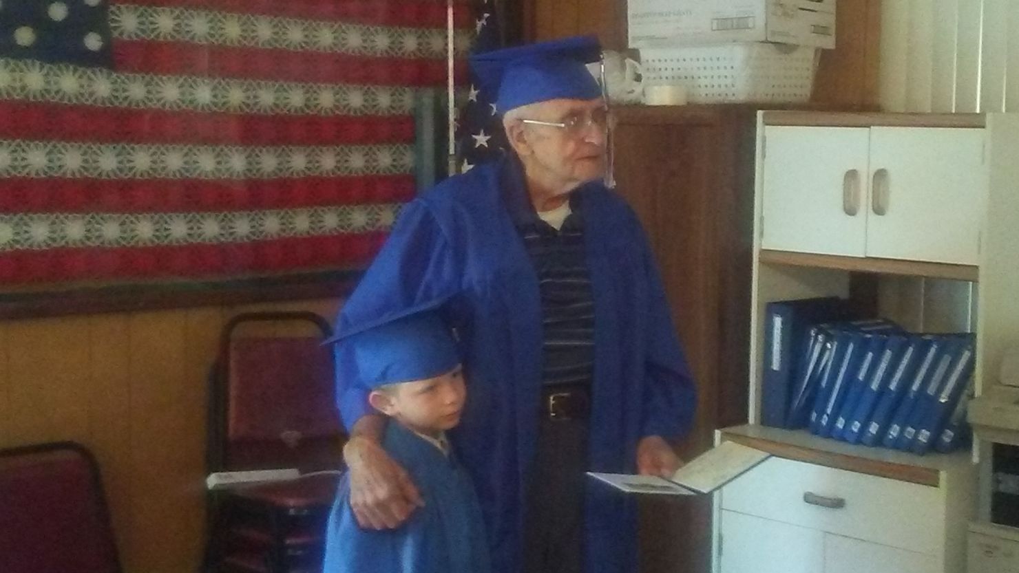 Milton Mockerman, right, finally received his high school diploma -- about 71 years after he should have been done with school.
