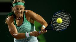 KEY BISCAYNE, FL - MARCH 31:  Victoria Azarenka of Belarus returns a shot to Angelique Kerber of Germany during the semifinals of the Miami Open presented by Itau at Crandon Park Tennis Center on March 31, 2016 in Key Biscayne, Florida.  (Photo by Matthew Stockman/Getty Images)
