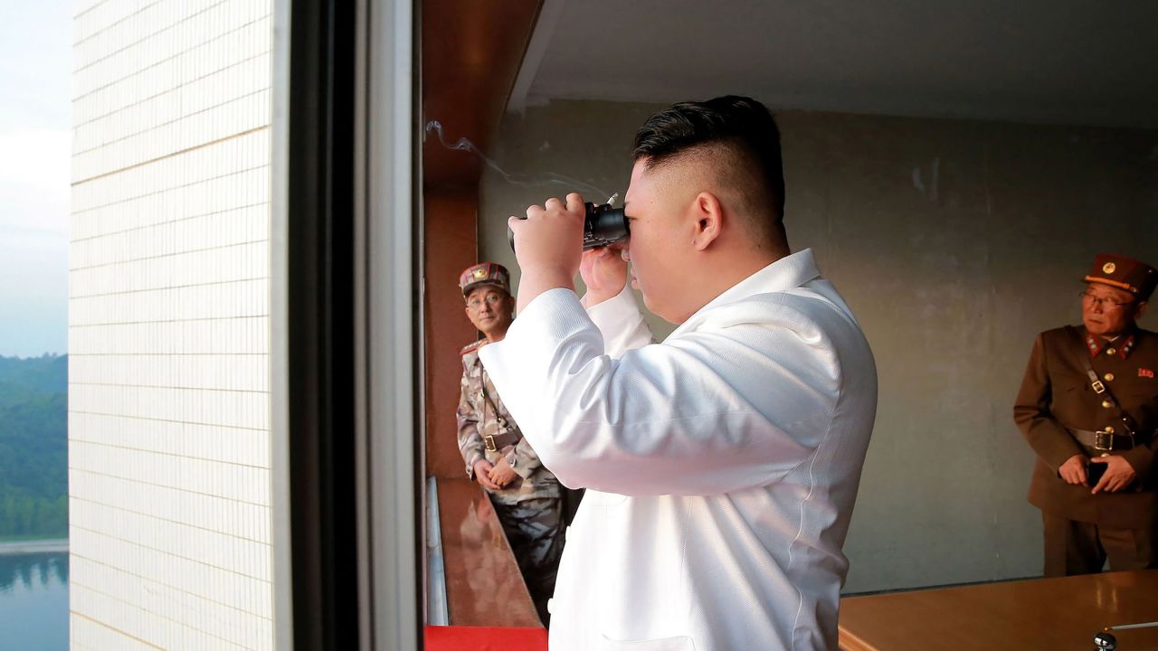 This undated photo released by North Korea's official Korean Central News Agency (KCNA) on Tuesday shows Kim Jong Un inspecting a test-fire of a ballistic missile.