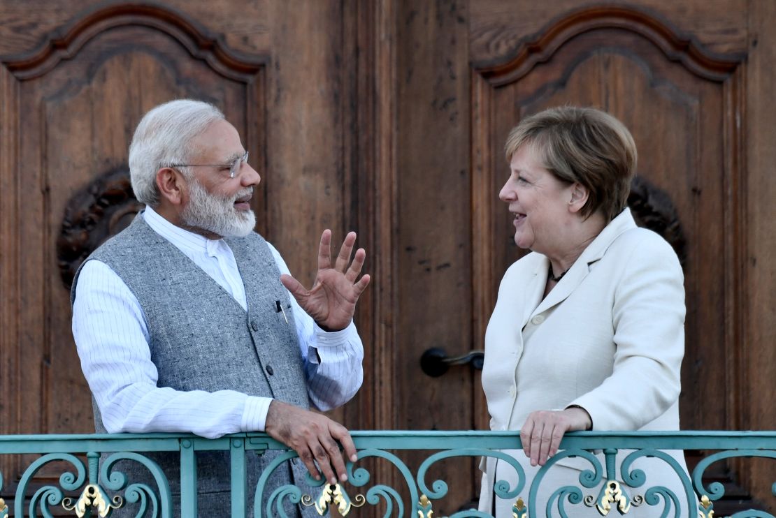 Merkel hailed India's committment to the Paris climate deal after meeting Modi (L) on Tuesday.