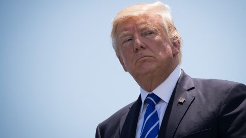 US President Donald Trump looks on as he hands out diplomas to Coast Guard cadets at the commencement ceremony at the US Coast Guard Academy, May 17, 2017 in New London, Connecticut. This is President Trump's second commencement address since taking office and comes amid controversy after his firing of FBI Director James Comey.
