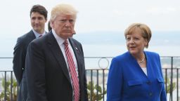 US President Donald Trump (L) walks along with German Chancellor Angela Merkel at the Belvedere of Taormina during the Summit of the Heads of State and of Government of the G7 on May 26, 2017 in Sicily.(Mandel Ngania/AFP/Getty Images)