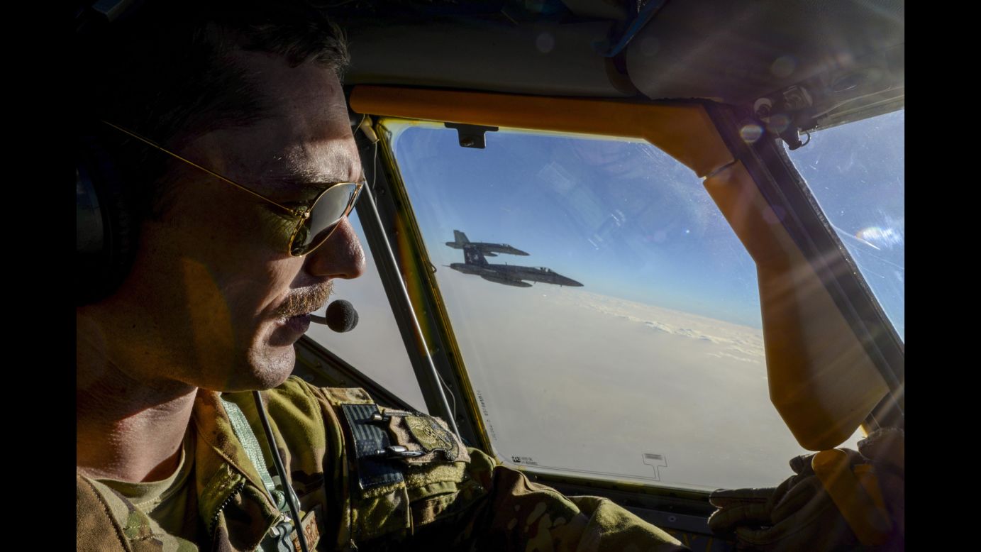 Air Force Capt. Timothy Black pilots a KC-135 Stratotanker next to two Navy fighter jets on Sunday, May 21. The Stratotanker is part of a refueling squadron that is supporting the mission against ISIS.