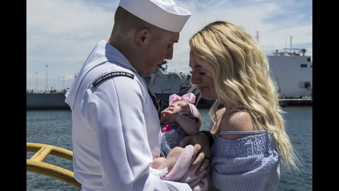 Navy Petty Officer 2nd Class Dylan Bagdasarian says goodbye to his wife and daughter in San Diego before setting off on a scheduled deployment on Monday, May 8.