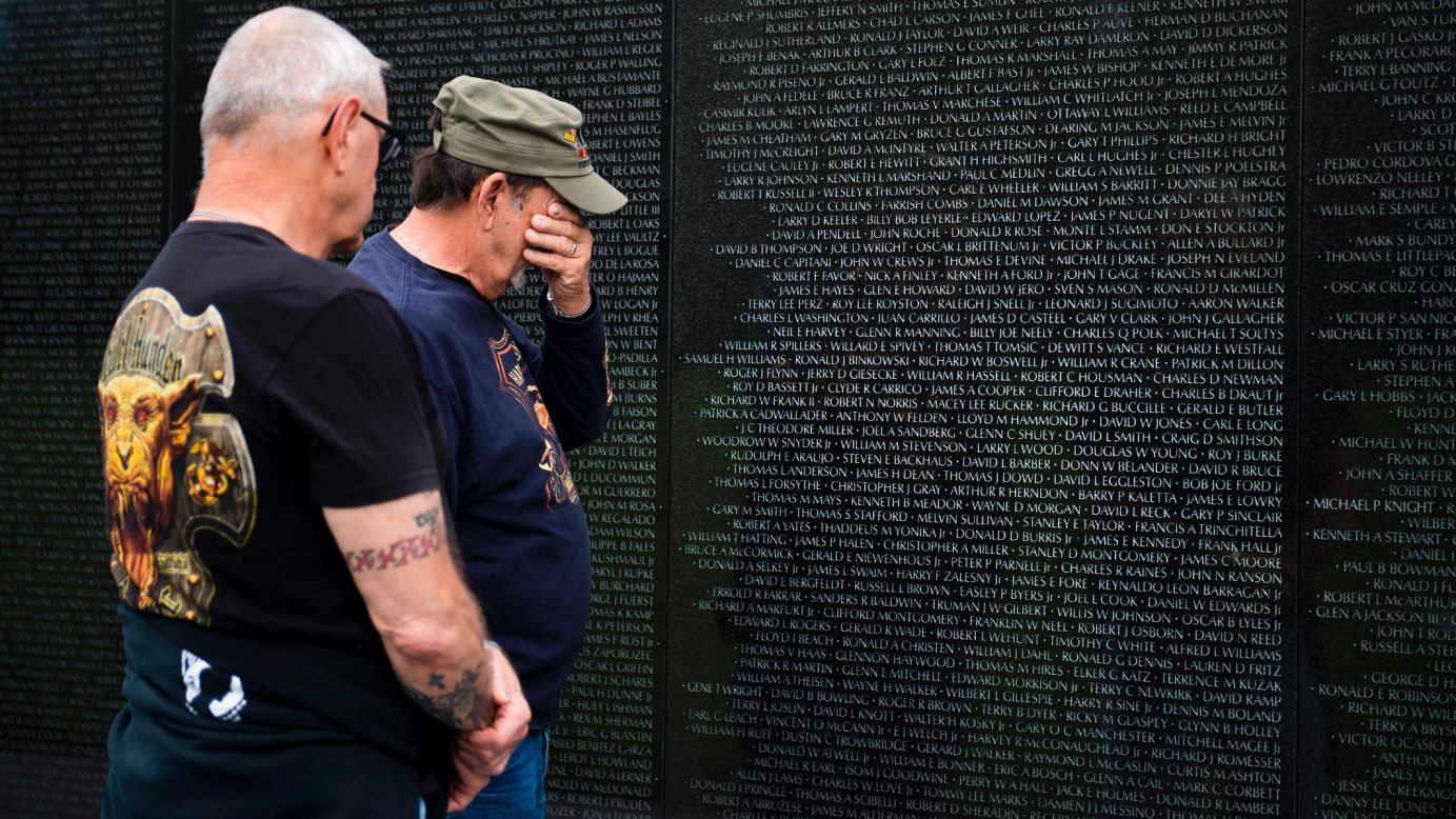 Vietnam veterans Ed Hriscko, left, and Skip Georgal visit the Vietnam War Memorial in Washington on Friday, May 26.