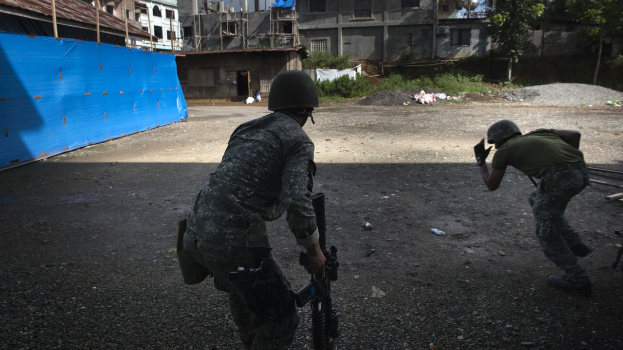Filipino soldiers engage in a firefight with ISIS-linked militants on May 30, 2017, in Marawi in the southern Philippines.