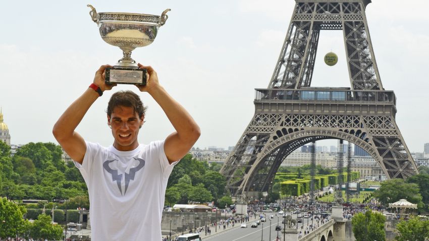 PARIS, FRANCE - JUNE 09: Rafael Nadal of Spain poses with the Coupe des Mousquetaires trophy in front of the Eiffel Tower after his victory against Novak Djokovic of Serbia during day 16 of the French Open at Roland Garros on June 9, 2014 in Paris, France.  (Photo by Frederic T Stevens/Getty Images)