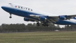 DULLES, UNITED STATES: United Airlines flight #897, a Boeing 747, lifts off from Washington, DC's Dulles International Airport on it's maiden non-stop 13-hour flight from Washington, DC to Beijing 28 March 2007. This is the first-ever nonstop flight between Washington, DC and Beijing connecting the two capitals. AFP Photo/Paul J. Richards (Photo credit should read PAUL J. RICHARDS/AFP/Getty Images)