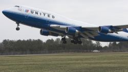 DULLES, UNITED STATES: United Airlines flight #897, a Boeing 747, lifts off from Washington, DC's Dulles International Airport on it's maiden non-stop 13-hour flight from Washington, DC to Beijing  28 March 2007. This is the first-ever nonstop flight between Washington, DC and Beijing connecting the two capitals.   AFP Photo/Paul J. Richards (Photo credit should read PAUL J. RICHARDS/AFP/Getty Images)