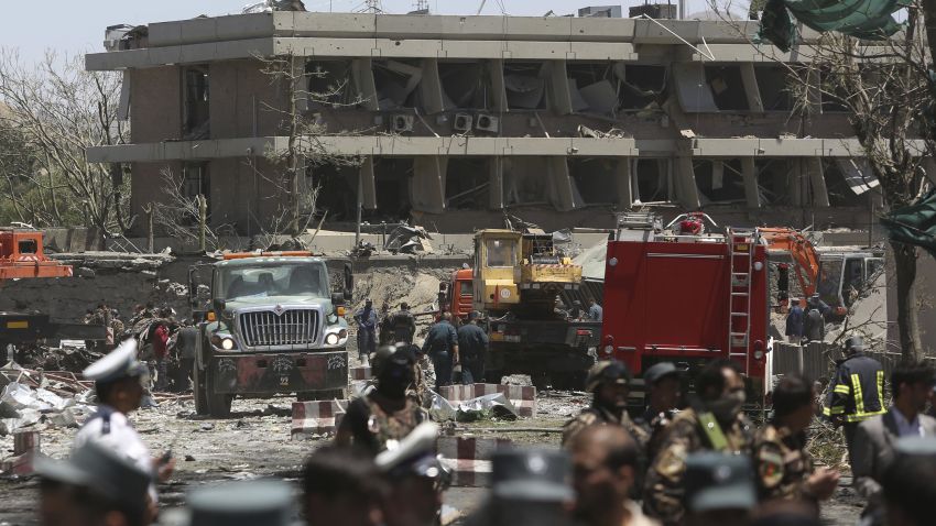 Security forces are seen in front of the German Embassy after a suicide attack in Kabul, Afghanistan, Wednesday, May 31, 2017. A massive explosion rocked a highly secure diplomatic area of Kabul on Wednesday morning, causing casualties and sending a huge plume of smoke over the Afghan capital. (AP Photos/Rahmat Gul)