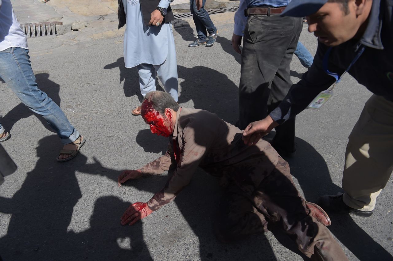 An injured man receives aid following the attack.