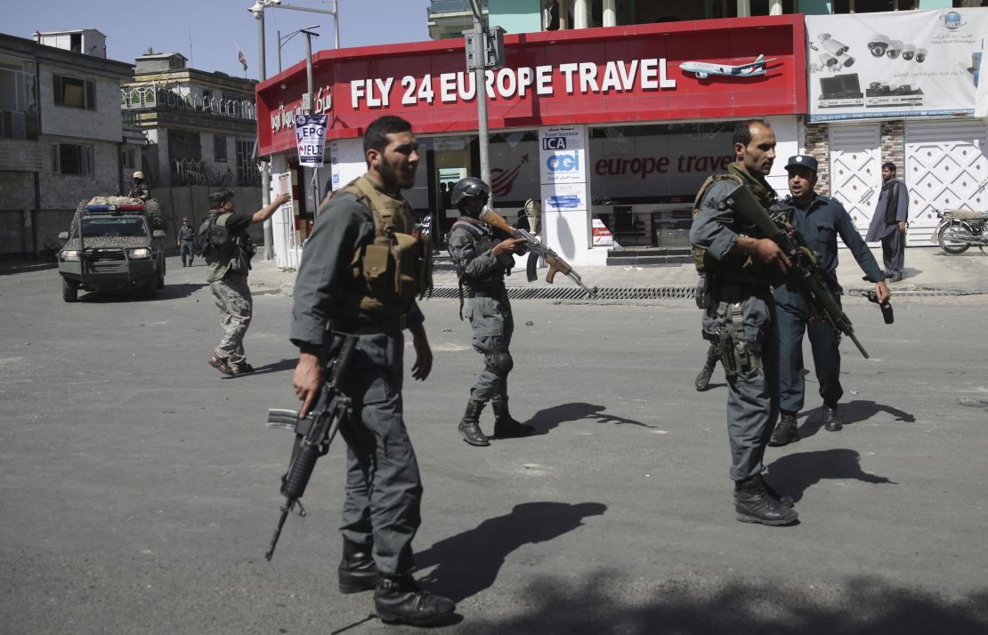 Security forces stand near the site of the bombing on Wednesday.