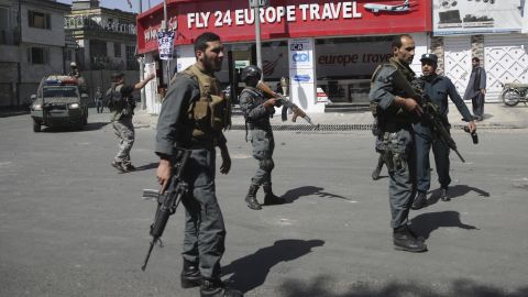 Security forces stand near the site of the bombing on Wednesday.