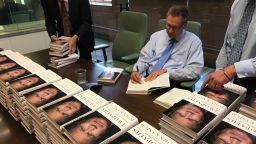 Ohio Gov. John Kasich signs copies of his book "Two Paths: America Divided or United"