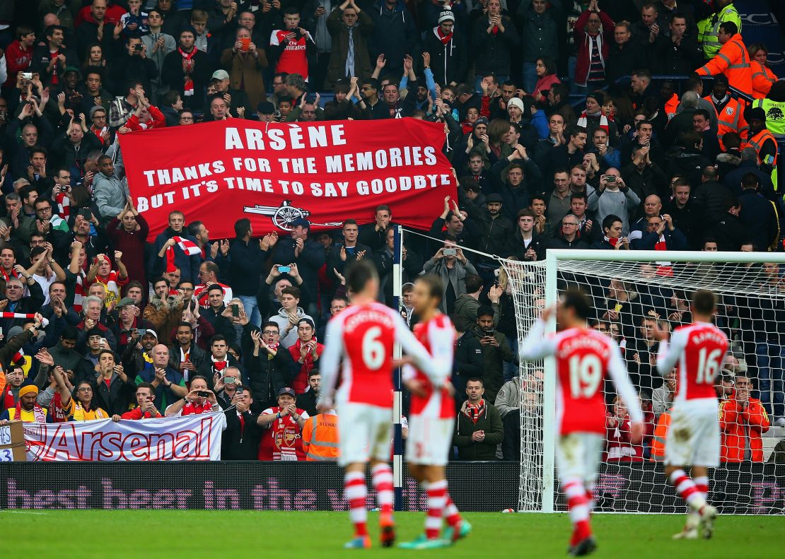  Arsenal fans hold up a banner during the English Premier League match between West Bromwich Albion and Arsenal at The Hawthorns on November 29, 2014 