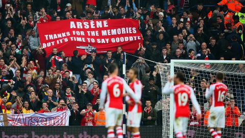 Arsenal fans hold up a banner during the English Premier League match between West Bromwich Albion and Arsenal at The Hawthorns on November 29, 2014