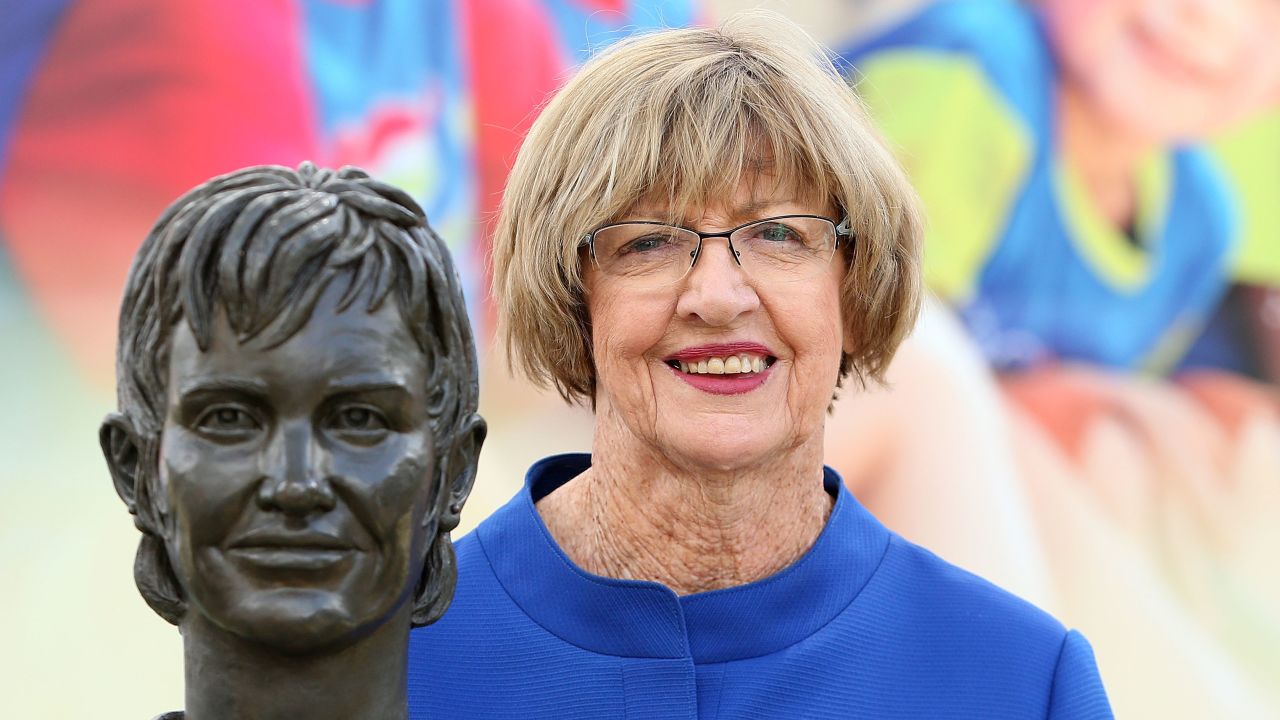 Margaret Court poses with a bronze bust of herself during the 2015 Australian Open at Melbourne Park on January 29, 2015.