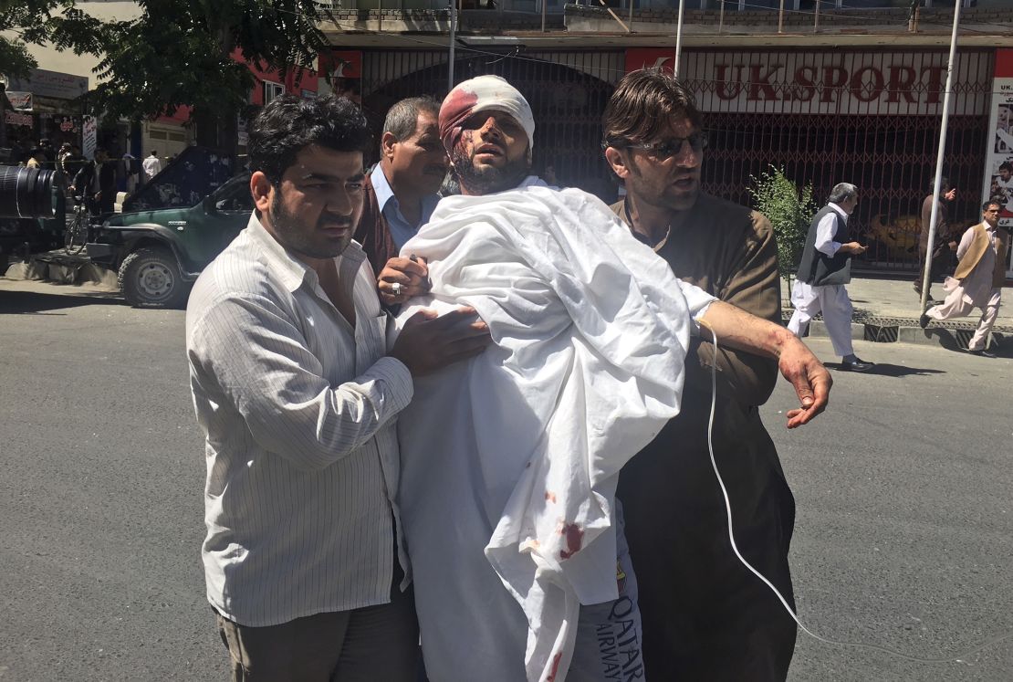 People carry an injured man after the attack on Wednesday.