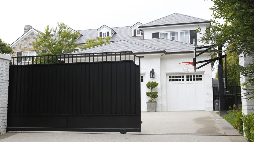 The front gate of a home belonging to Cleveland Cavaliers' LeBron James is freshly repainted Wednesday, May 31, 201, in Los Angeles. Police are investigating after someone spray painted a racial slur on the front gate of James' home in Los Angeles on the eve of the NBA Finals. (AP Photo/Damian Dovarganes)