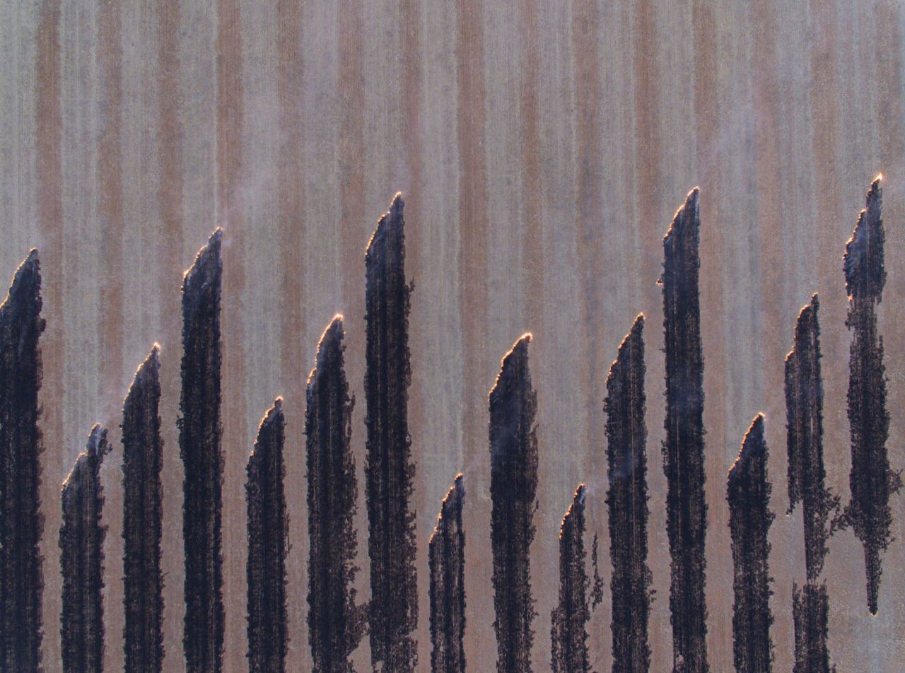 <strong>West Wyalong, New South Wales:</strong> One of 12 short-listed images, this photo by <a href="https://www.skypixel.com/user/mal-lak" target="_blank" target="_blank">Mal Lak</a> of stubble being burned in a field near the New South Wales' town of West Wyalong offers a unique perspective of the rural landscape.  