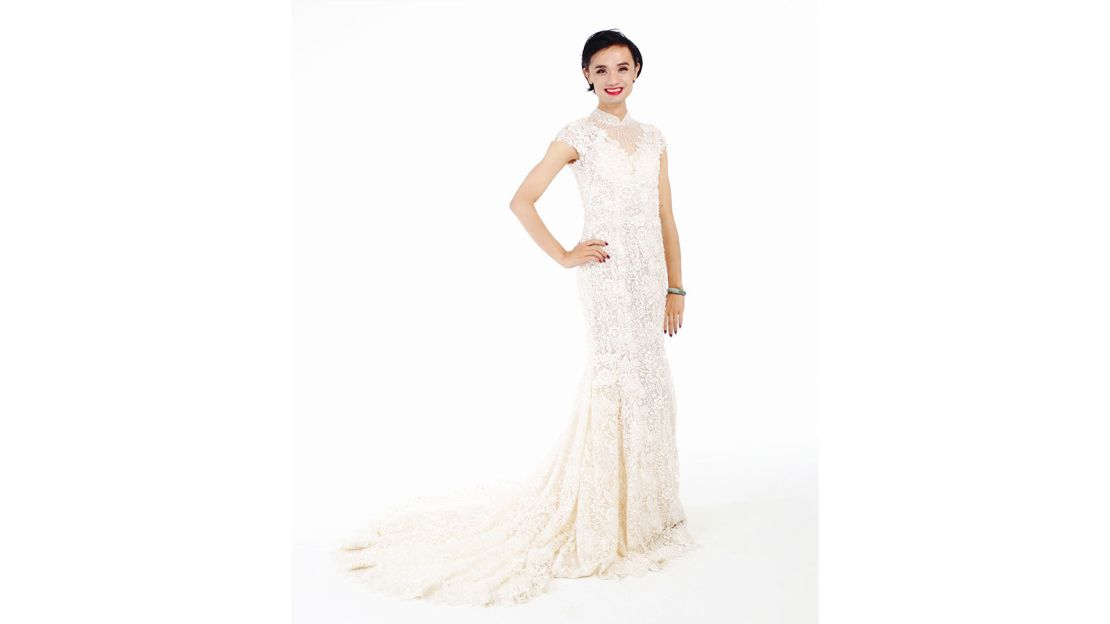 Chao Xiaomi poses in a hand-made white lace dress from Taiwan.