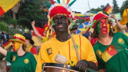 People in blackface wear Cameroon national team jerseys and carry bananas while marching in a government-backed parade in Sochi, Russia on May 27. The city will host one of Cameroon's matches at the Confederations Cup soccer tournament  