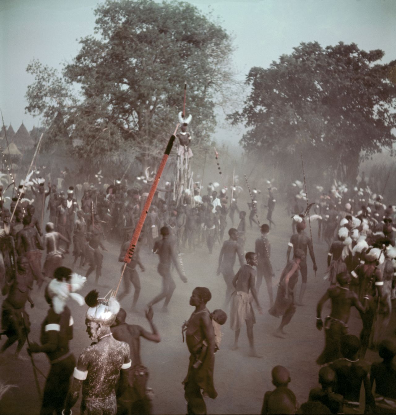 Latuka people perform a rain dance, 1948. The annual event takes place to bring luck to the harvest and ends with an animal sacrifice. The size of the animal, caught by Moyimiji warriors, correlates to the size of the harvest -- so the larger the beast the better. <br /><br />