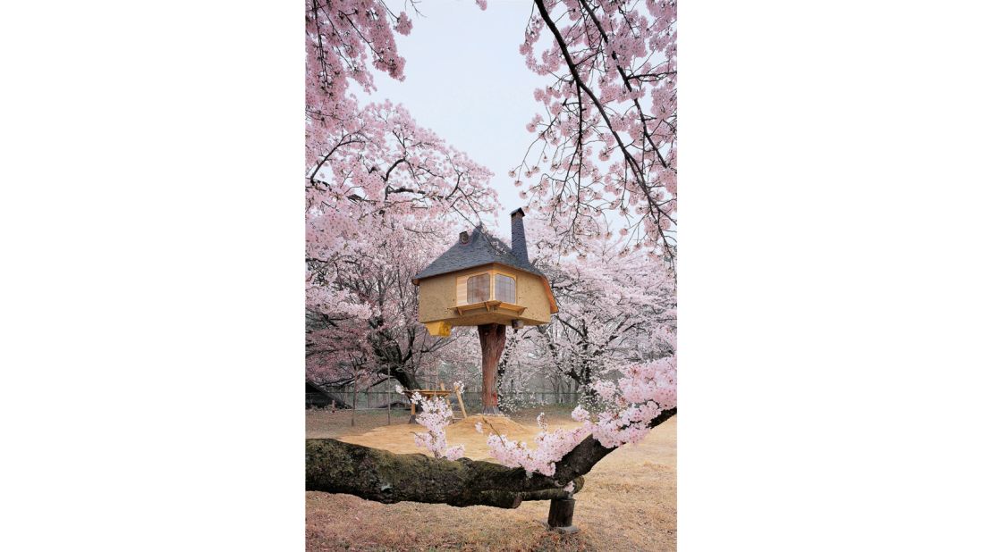 Framed by an abundance of cherry blossoms, the Teahouse Tetsu by Terunobu Fukimori looks as though it's from a different world. Of the small house, the designer says: "It looks as though it were a house for a midget from a fairy tale."