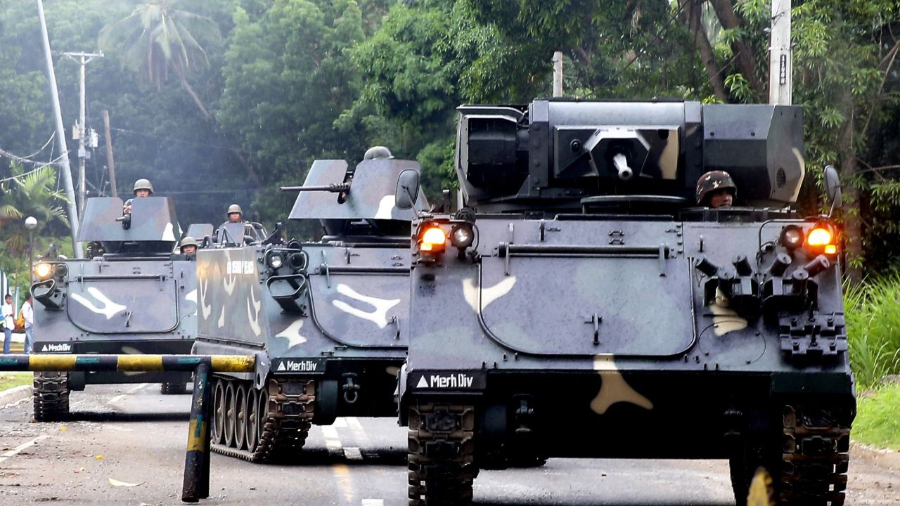 Philippines government armored vehicles enter Marawi on May 31.