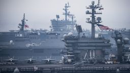 The US aircraft carriers USS Carl Vinson, foreground, and USS Ronald Reagan, back, steam with the Japanese helicopter carrier JS Hyuga, center, in the Sea of Japan/East Sea during an exercise on June 1, 2017.