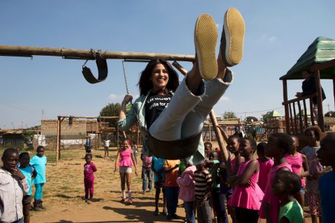 On 7 May 2017 in South Africa, (foreground) UNICEF Goodwill Ambassador Priyanka Chopra plays on a swing as children watch, at the Isibindi Safe Park in Soweto Township, in the city of Johannesburg. Safe Parks established through the UNICEF-supported Isibindi project are designated community areas where Child and Youth Care Workers engage children in constructive, age-appropriate educational and recreational activities after school. The community-based program was developed by the National Association of Child Care Workers to help respond to the needs of orphans and other vulnerable children. Through the Isibindi program, local community members are trained as Child and Youth Care Workers to identify and provide support for vulnerable families to ensure that at-risk children have access to essential services. These services can include accompanying children to school, a health clinic or the hospital if needed; as well as helping children obtain important official documents, such as birth certificates; as well as government grants; psychosocial support; and counseling. Goodwill Ambassador Chopra is in the country to raise funds on behalf of vulnerable children and to visit UNICEF-supported program sites.