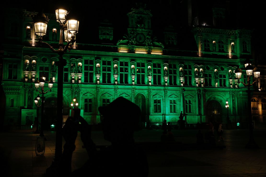 A picture taken Thursday shows the City Hall of Paris illuminated in green following Trump's decision.