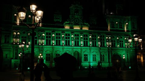A picture taken Thursday shows the City Hall of Paris illuminated in green following Trump's decision.
