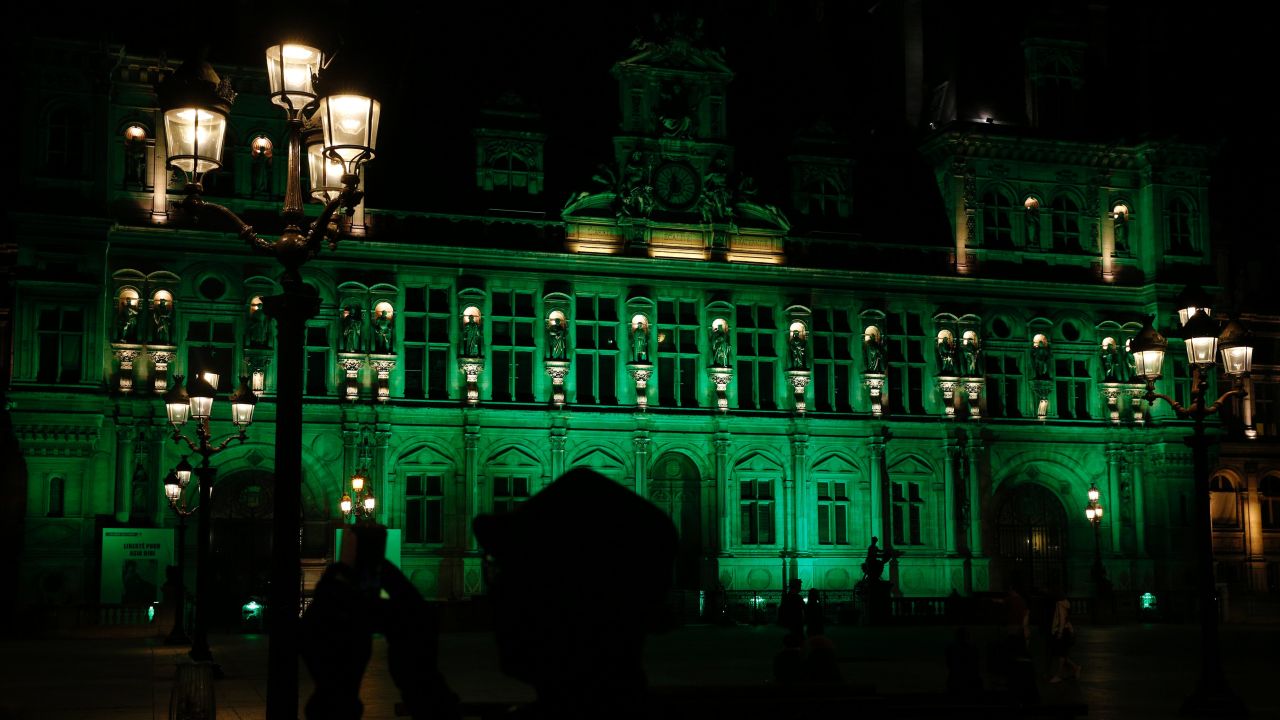 A picture taken Thursday shows the City Hall of Paris illuminated in green following Trump's decision.