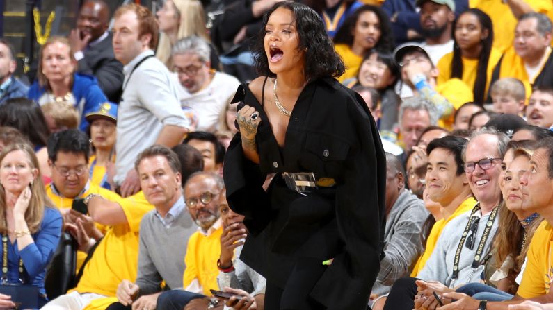 Singer Rihanna cheers from the sideline during Game 1. She was one of many celebrities there, but <a href="index.php?page=&url=http%3A%2F%2Fwww.cnn.com%2F2017%2F06%2F02%2Fentertainment%2Frihanna-nba-finals%2Findex.html" target="_blank">she took most of the headlines.</a>