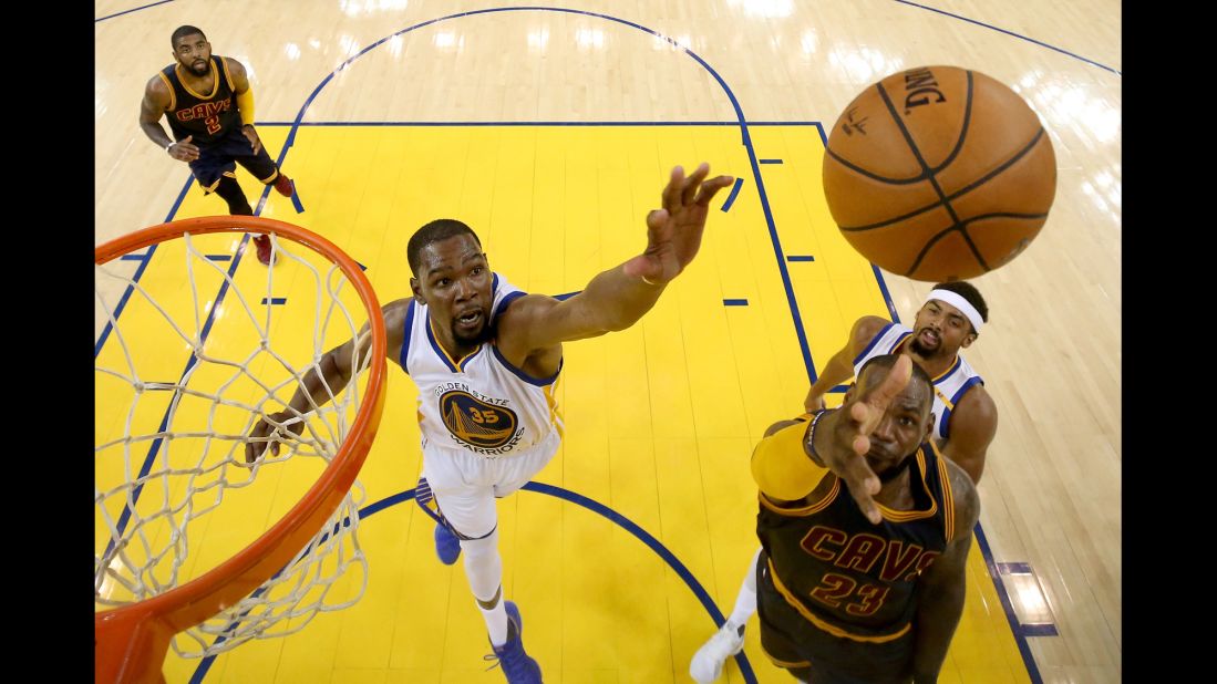 James goes up for a shot against Durant during the first game on Thursday, June 1. Durant scored a game-high 38 points for the Warriors, who opened the Finals with a dominating 113-91 victory.