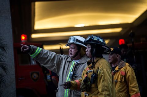 Firemen arrive at the Resorts World Hotel.