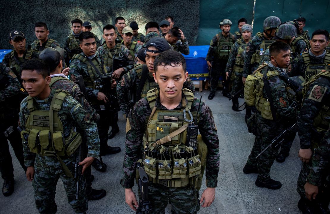 Soldiers stand in front of the Resorts World Hotel following an attack in Manila on June 2, 2017.