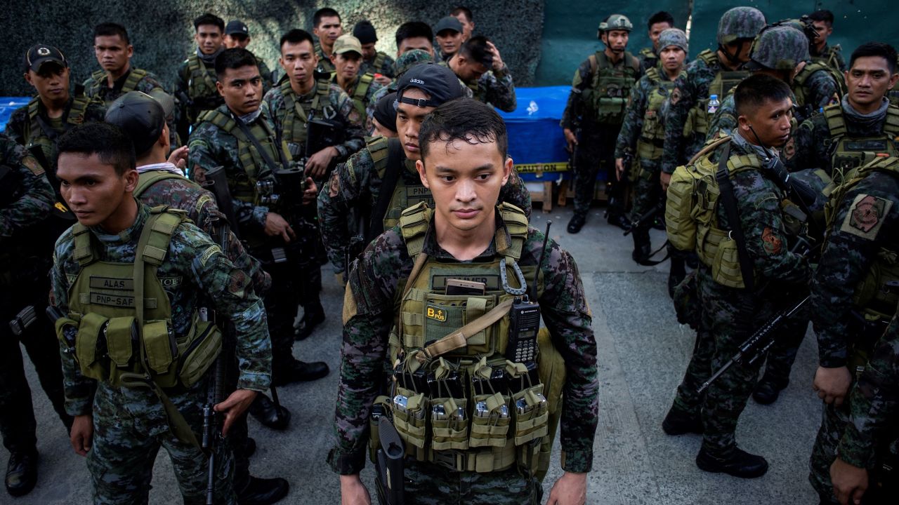 Soldiers stand in front of the Resorts World Hotel following an attack in Manila on June 2, 2017.