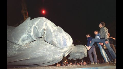 Once the world's largest police and spy agency, the KGB met its end in 1991 after an unsuccessful coup attempt by its chief officer, Vladimir Kryuchkov. Taken days after the failed coup, this August 23, 1991, photo shows Muscovites stepping on the head of a toppled statue of KGB founder Felix Dzerzhinsky.