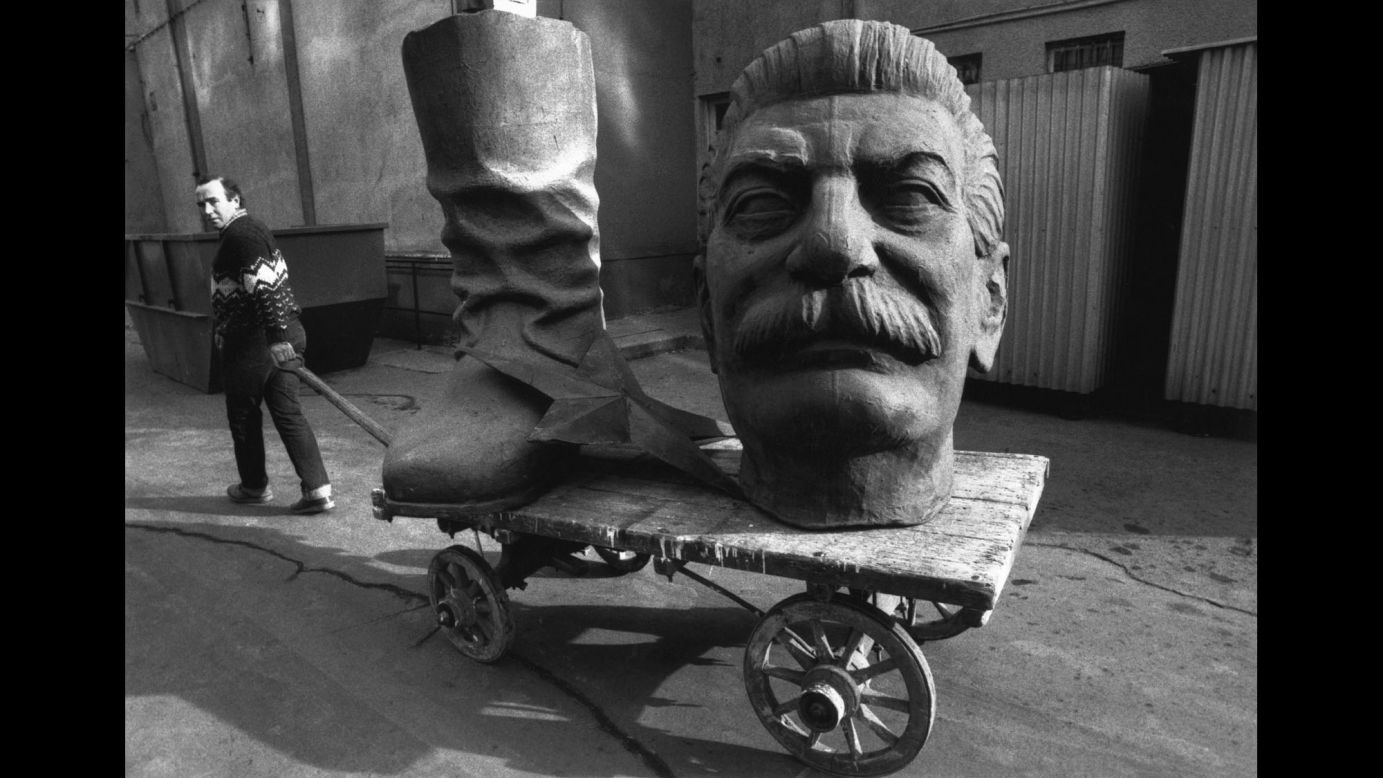 One by one, Eastern European countries cut their ties with Moscow in the early 1990s, leading to the fall of communism and the dissolution of the Soviet Union. In this 1990 photo from Hungary, a dismantled statue of Joseph Stalin is dragged through the streets of Budapest.